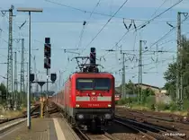 112 149-0 erreicht mit dem RE 21079  SH-Express  den Bahnhof von Neum�nster auf dem Weg nach Hamburg Hbf. Aufgenommen am 20.07.10.