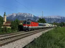 Die 1144 216 am 05.06.2010 mit einer RoLa unterwegs bei Niederaudorf.  