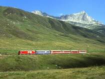 MGB exFO GLACIE-EXPRESS F 901 von Chur nach Zermatt am 24.08.1997 oberhalb N�tschen mit E-Lok HGe 4/4II 108 - RhB WR 3812 - Br 4293 - B 4263 - PS 4011.
