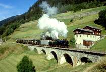 RhB DAMPFEXTRAZUG f�r GRAUB�NDEN TOURS 3236 von Disentis nach Chur am 31.08.1997 bei Compadials mit Dampflok G 4/5 107 - Xk 9398 - D� 4052I - B 2247 - B 2246.
