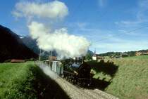 RhB DAMPFEXTRAZUG f�r GRAUB�NDEN TOURS 3236 von Disentis nach Chur am 31.08.1997 bei Campliun mit Dampflok G 4/5 107 - Xk 9398 - D� 4052I - B 2247 - B 2246.
