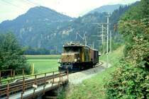 RhB G�TERZUG 5238 von Disentis nach Landquart am 27.08.1997 Einfahrt Rueun mit E-Lok Ge 6/6I 411 - Gbkv 5561. Hinweis: Lok hat Wagen aus Milit�rdepot Rueun abgeholt - Lok nach Unfall 09.02.2000a - zur Zeit ausgestellt Deutsches Museum M�nchen