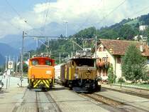 RhB G�TERZUG 5238 von Disentis nach Landquart am 27.08.1997 Einfahrt Ilanz mit E-Lok Ge 6/6I 411 - Gbkv 5561 - Ucek 8063 - Uce 8045 - Ucek 8064 - Uce 8033 - Uce 8013 - Uce 8043. Daneben steht E-Lok Ge 2/4 212. Hinweis: Lok nach Unfall 09.02.2000a - zur Zeit ausgestellt Deutsches Museum M�nchen