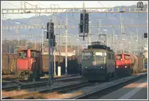 Eine Ae 6/6 und zwei Tm IV im letzten Abendlicht in St.Margrethen (29.10.2010)