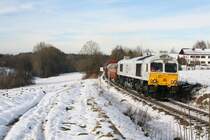 247 059-9 k�mpfte sich die Steigung vom Alz-Tal nach Pirach am 07.12.10 hinauf.