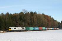 247 041-7 hatte am 07.12.10 auf dem Weg nach Landshut das  Wacker-Shuttle  am Haken und wurde von Burghausen kommend bei Pirach fotografiert.