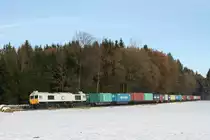 247 041-7 hatte am 07.12.10 auf dem Weg nach Landshut das  Wacker-Shuttle  am Haken und wurde von Burghausen kommend bei Pirach fotografiert.