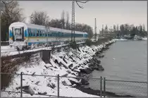 Gezeichnet von der Fahrt durch den Allg�uer Schnee erreicht ein ALEX in K�rze Lindau Hbf. (02.12.2010)