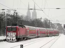 112 xxx-x mit dem RE7 nach M�nster im winterlichen K�ln Messe/Deutz am 24.12.2010