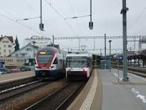 Schon am 2. Tag in Folge war der RABe 511 001  Berlin  am 04.01.2011 in Romanshorn auf Testfahrt. Daneben ein Thurbo GTW der �lteren Generation.