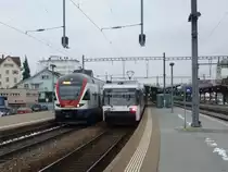 Schon am 2. Tag in Folge war der RABe 511 001  Berlin  am 04.01.2011 in Romanshorn auf Testfahrt. Daneben ein Thurbo GTW der �lteren Generation.