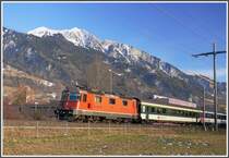 Vor dem Vilan verlsst RE3832 mit Re 4/4 II 11214 Maienfeld. (04.01.2011)