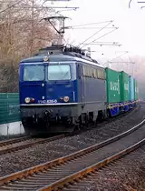 Kurz vor der Einfahrt in den Bahnhof Grevenbroich kommt am sp�ten Nachmittag des 4.M�rz2011 1142 635-0 mit einem Containerzug gen Rheydt gefahren.
