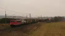 155 077-1 mit 62210 Richtung Genshagener Heide und dem Blick bis zur Kirche Saarmunds durch die Kurve. F�r diese Betrachtung machen sich die Wolken doch sehr gut. Gr��e zur�ck !