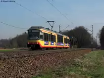 24.03.2011: Wagen 881 mit Werbung von KVV Quattro als S32 von Menzingen nach Karlsruhe Hbf. Aufgenommen zwischen Weingarten und Karlsruhe-Durlach.
