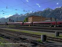 railjet 567 Bregenz - Wien West durchmi�t eilenden Schrittes Hall. Im Hintergrund die Nordkette vom Hechenberg bis zum Kamm, der das Halltal s�dlich begrenzt, davor noch die Rumerspitze. Mitten im Gleisfeld des Haller Bahnhofs eine 2068, die im Rahmen des Fortgangs der Ereignisse bzw. im Gefolge desjenigen des hier dargestellten fl�chtigen Gastes im Rangieren fortfahren wird, dieses gemeinsam mit ihrer Schwester (siehe folgende Bilder). Mitte April 2011 kHds