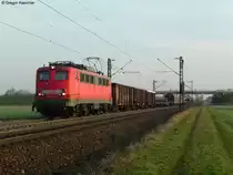 25.03.2011: Die 140 506-7 mit einem gemischten G�terzug Richtung S�den bei Graben-Neudorf.