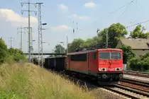 155 075-5 am 06. Juni  2011 vor einem gemischten G�terzug nach der Durchfahrt durch den Bahnhof Berlin Sch�nefeld Flughafen Richtung Genshagener Heide 