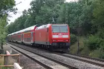 Mit einer RE nach Norddeich Mole ist hier die 146 123-5 unterwegs unweit der Orschaft Blumenau. 23.6.2011
