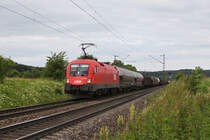 1116 133 mit einem gemischten Gterzug am 21.06.2011 bei Plling.