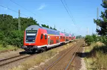 Den Haltepunkt Demker durch f�hrt gerade der RE20 (RE 17709) von Uelzen nach Halle(Saale) Hbf. Geschoben hatte die 112 169. 22.08.2011  