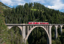 ABe 8/12 3515	 Alois Carigiet  am 14. August 2011 als R 1817 (Davos-Platz - Filisur) bei Davos-Wiesen.