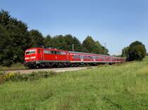 Die 111 022 mit einem RE nach Salzburg am 03.09.2011 unterwegs bei Osterm�nchen. 