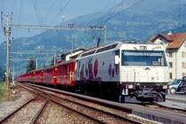 RhB Schnellzug 35 von Landquart nach Davos Platz am 23.08.1997 in Schiers mit E-Lok Ge 4/4 III 649 - D 4226 - A 1242 - B 2371 - B 2381 - B 2427 - B 2372 - B 2444 - B 2355 - AB 1520. Hinweis: Lokwerbung inzwischen ge�ndert 
