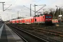 114 033 4 mit einem RE nach Eisenh�ttenstadt bei der Ausfahrt in Berlin Wannsee am 10.12.2011