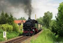 99 735 mit ihrem Personenzug im Mai 2005 in der Steigung zwischen Olbersdorf/Oberdorf und Bertsdorf.
