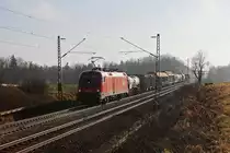 Gegenlichtaufnahme von 1116 120 mit einem gemischten G�terzug am 28.12.2011 bei Hilperting.