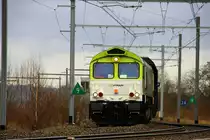 Die Class 66 6603 von Captrain ist mit einem Koksleerzug unterwegs in Richtung L�ttich-Seraing(B). Fotografiert am 2.1.2012 in Montzen-Gare(B) aus Aachen-West kommend.