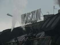 W�rmeverzerrtes Bahnhofsschild  Wolstyn . 29.4.06