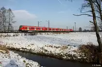 DB 143 869-6 schiebt N�rnberger S-Bahn S1 39143 Bamberg - Hartmannshof, KBS 890.1 Bamberg - Erlangen - F�rth - N�rnberg - Hartmannshof, fotografiert bei Baiersdorf am 31.01.2012 