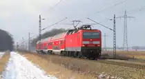 143 931-4 sieht man hier in Ahrensdorf mit der RB22 nach Berlin Sch�nefeld Flughafen fahren. 03.02.2012