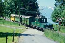 BC Museumsbahn Extrazug 75036 von Weiche-(Chaulin) nach Blonay am 24.05.1999 bei Cornaux mit E-Lok ex+GF+ Ge 4/4 75 - exCEG FZ 36 - exCEG C 230 - exRhB As 2. Hinweis: +GF+ = Georg Fischer AG Schaffhausen - CEG = Chemins de fer electiques la Gruyere.
