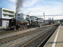 Die ex.SNCF 141.R.1244, vom Verein Mikado, mit einem Extrazug in Lyss. Dieser Extrazug von Steam Adventure Tours war wie folgt formiert: Dampflok: 3 AB, 2 Bm, 2 Speisewagen, 2 A EWI ex. BLS, A EWI ex. SBB und der RBe 4/4 1405 ex. SBB (heute DSF), Lyss, 10.03.2012.