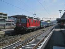 Ersatz RE 2947 bei Einfahrt in Lyss. Dies ist der Dispo Olten, bestehend aus der Re 4/4 II 11112 und 8 teiligem EW I/II Pendel, dieser Pendel ersetzt einen anderen Ersatzzug, 15.03.2012.