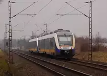 In der R�ckansicht ist eine RE 10 nach Kleve von hinten zu sehen, gerade ist sie noch �ber den Bahn�bergang Broicherseite Tilmeshof vor�bergfahren am 10.3.2012