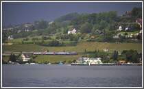 Ein Re 450 Dosto und die Autof�hre bei Meilen kurz vor einem Gewitter. (21.05.2012)