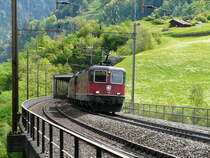 SBB - Re 4/4 11327 mit Re 6/6 11657 mit G�terzug unterwegs bei Intschi am 08.05.2012