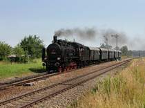 Die 38 1301 mit einem Sonderzug nach Mhldorf am 30.06.2012 bei der Durchfahrt in Tling.