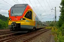 Ein 5-teiliger Flirt 429 042 / 542 der HLB (Hessischen Landesbahn) als RE 99 (Main-Sieg-Express) Siegen - Gie�en, f�hrt hier am 10.07.2012 bei Siegen-Ost in Richtung Gie�en.