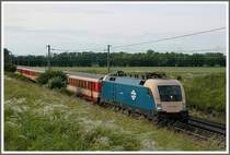 1047 003 am 9.6.2006 mit einem Regionalzug kurz vor Gramatneusiedl.