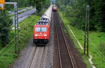 185 232-6 von Railion kommt mit einem Kesselzug aus Richtung Koblenz und fhrt in Richtung Kln Aufgenommen in Bad-Honnef am Rhein bei Regenwolken am 16.7.2012.