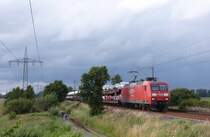 145 011-3 fuhr am 17.07.2012 mit einem Gterzug von Emden nach Osnabrck, hier sdlich von Leer.