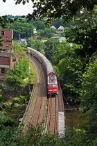 111 151-7 schiebt den RE 9 (Rhein-Sieg-Express) Aachen - K�ln - Siegen am 05.08.2012 in Richtung Siegen. Hier hat der RE den Scheuerfelder Tunnel verlasen und �berquert, wie so oft auf dieser Strecke, die Sieg.