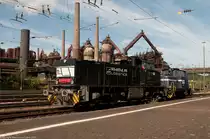 Ein G1206 von Rhenus Logistics/MRCE Dispo und ein unbekannter lok ist unterwegs von Dillingen nach V�lklingen, im hintergrund die Unesco Weltkulturerbe V�lklinger H�tte am 16 August 2012.