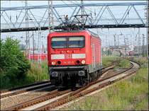 02.  114 011-0  soll den liegengebliebenen RE in den Hbf holen.  (Stralsund am 07.07.06)