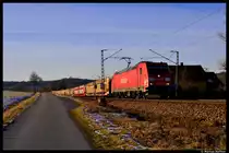185 209-4 mit einem leeren Autozug bei P�lling. Das Bild entstand am 18. Januar 2012.